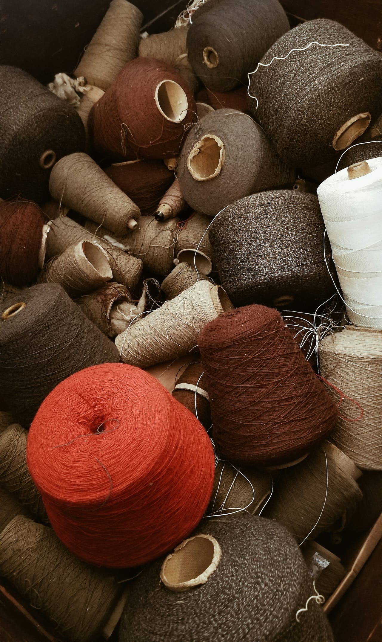 Collection of thread spools and fiber arts materials arranged at the Willamette Heritage Center, Salem, Oregon
