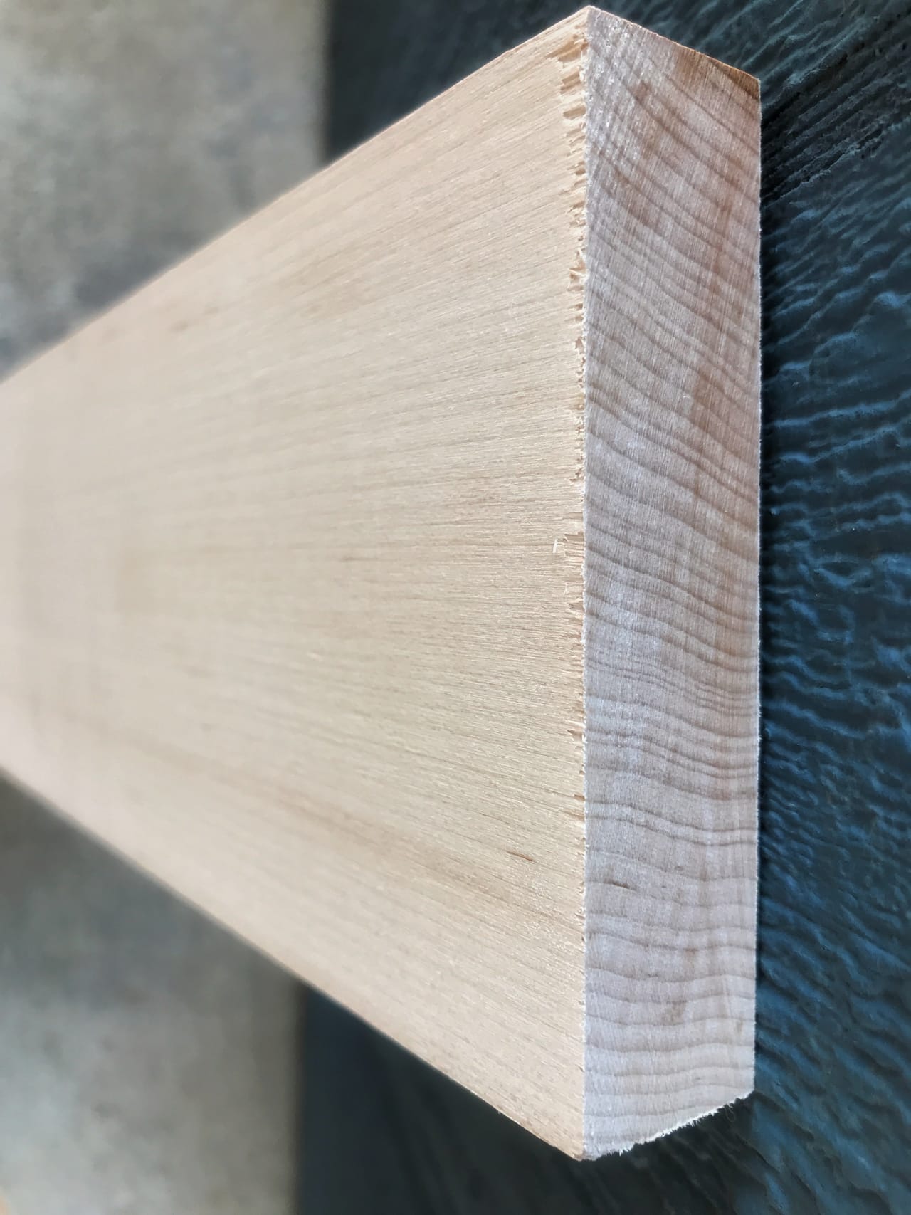 Close-up of quartersawn white hard sugar maple showing the tight, straight end-grain and face-grain characteristic of this hardwood species